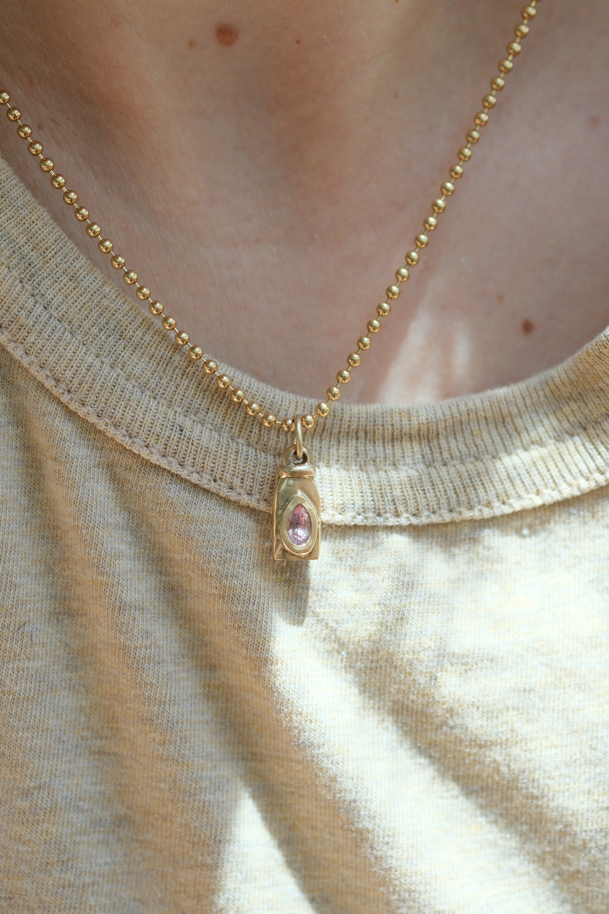 Nectar bottle charm: padparadscha sapphire