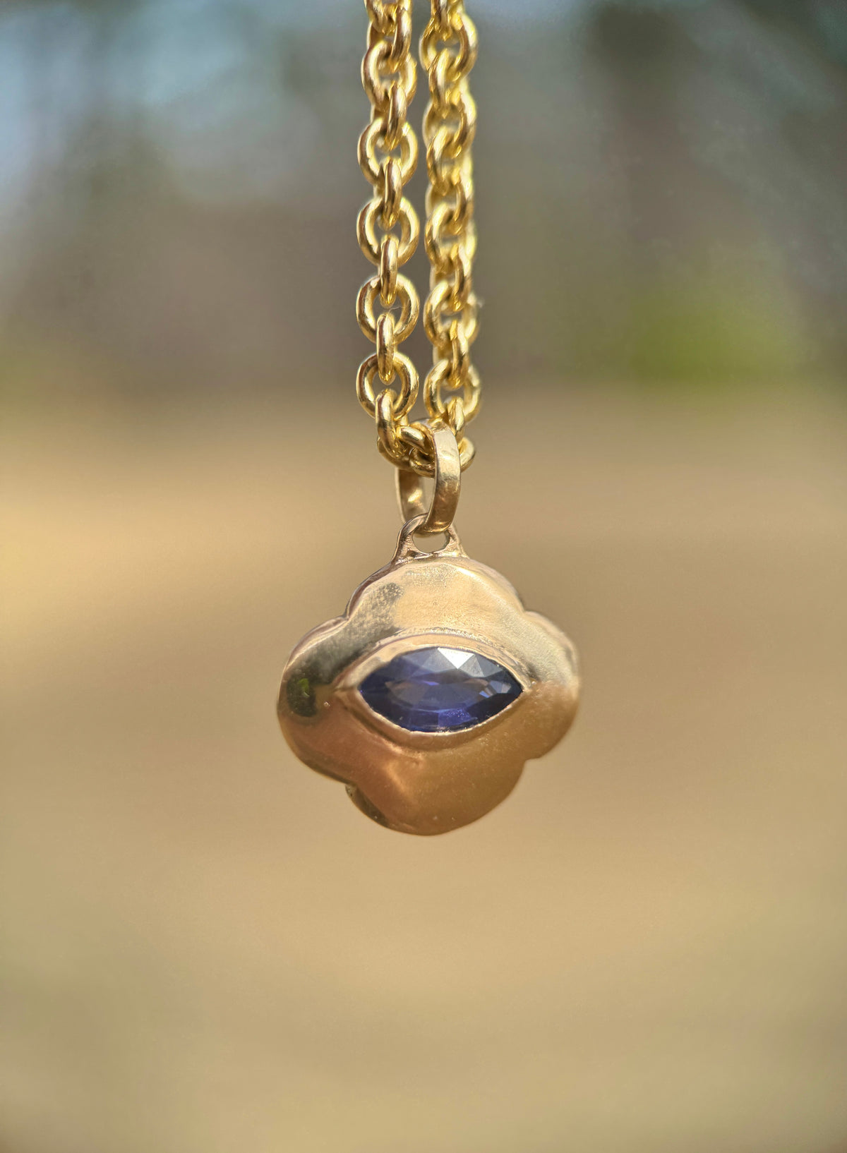 Watchful cloud pendant: blue sapphire