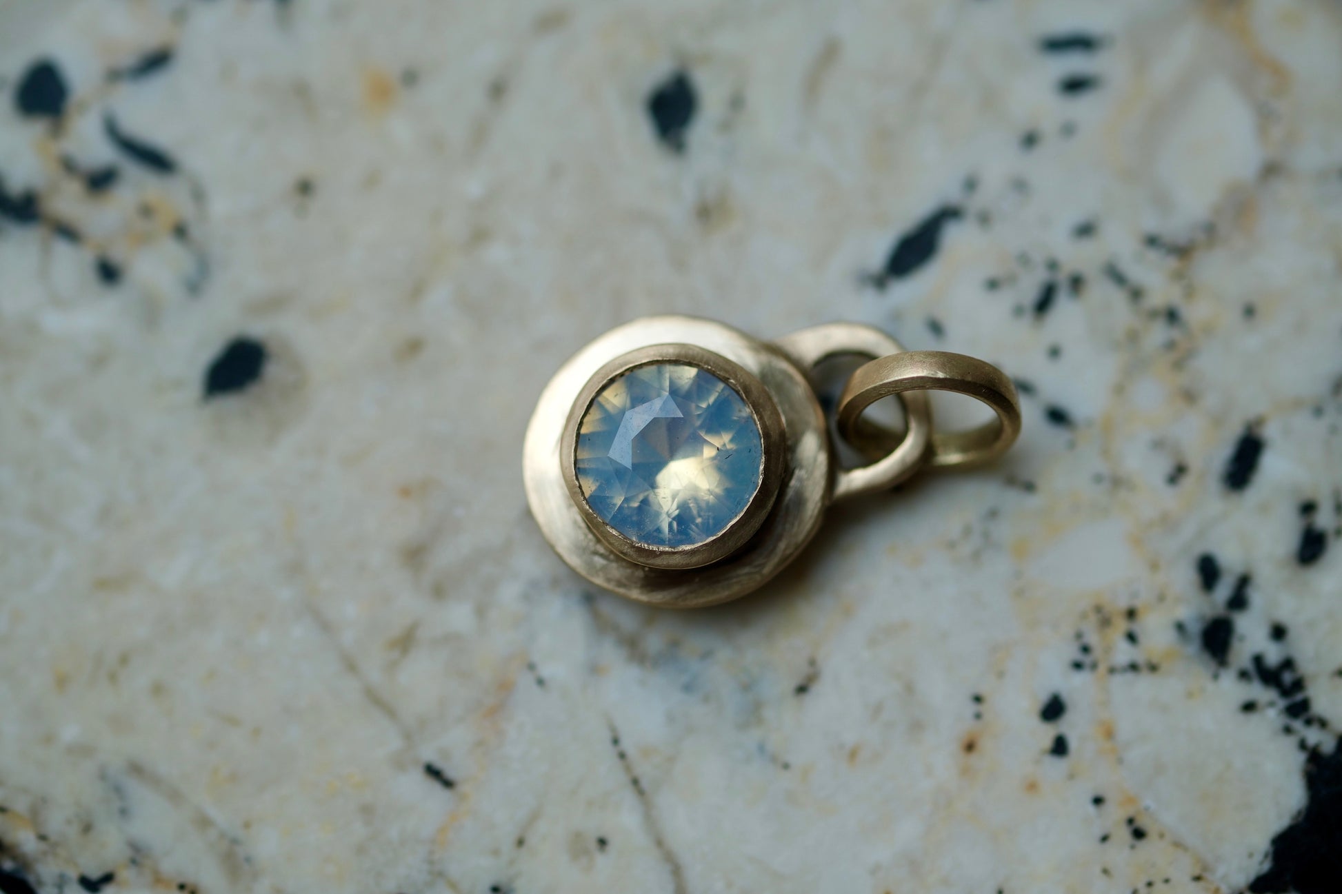Icy blue sapphire lock pendant