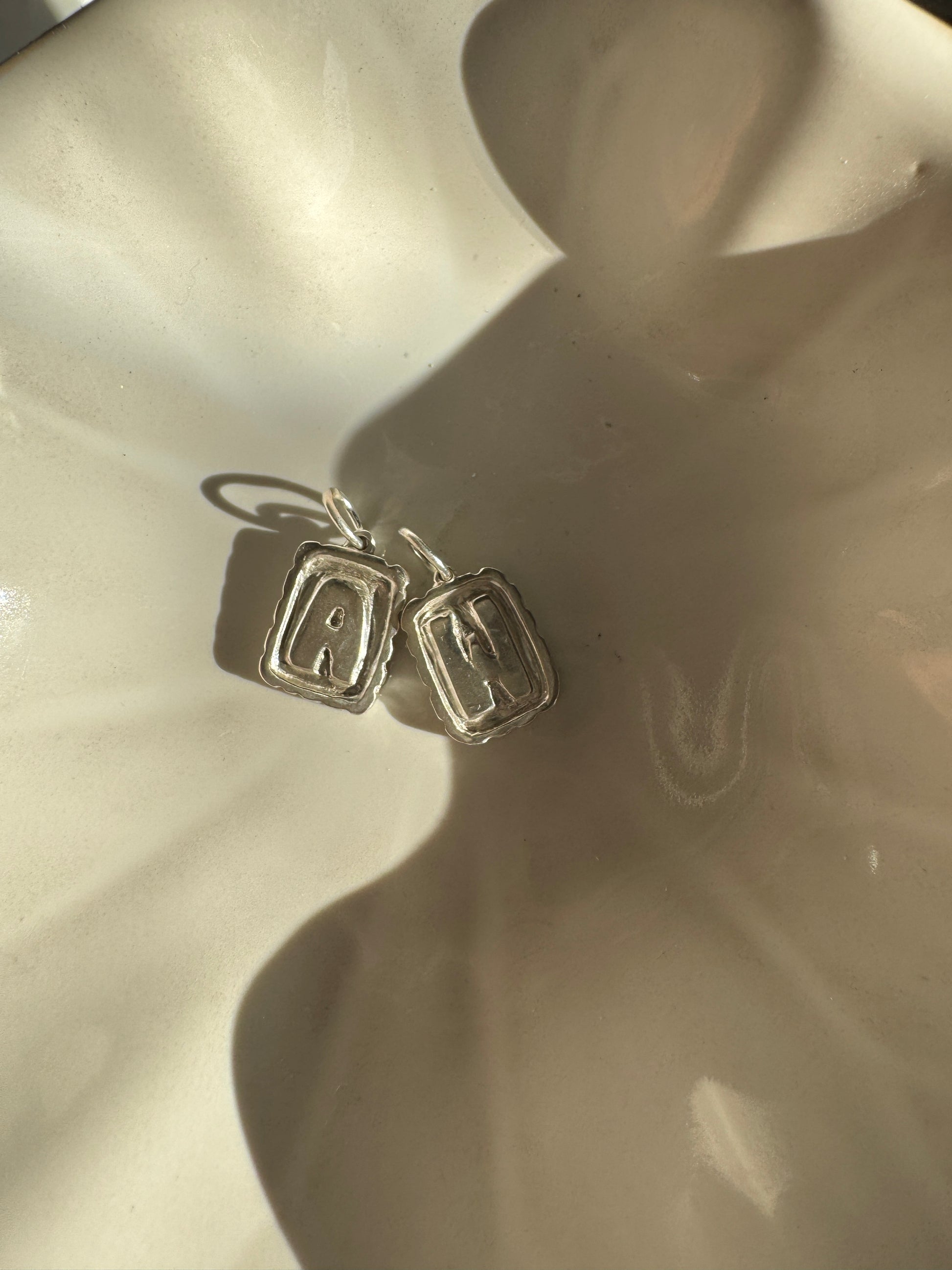 Initial charm by Mellis fine jewelry