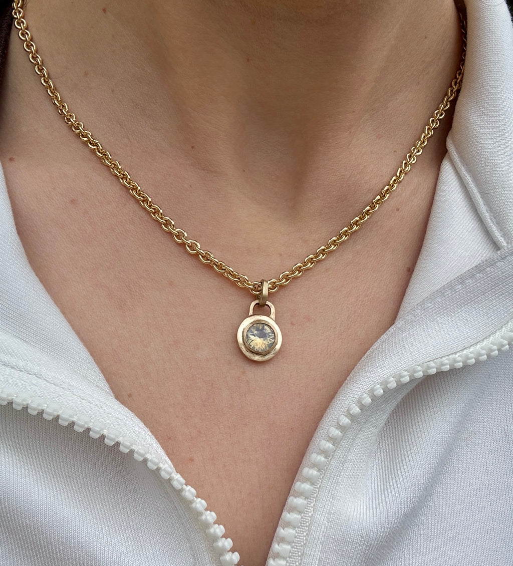 Icy blue sapphire lock pendant