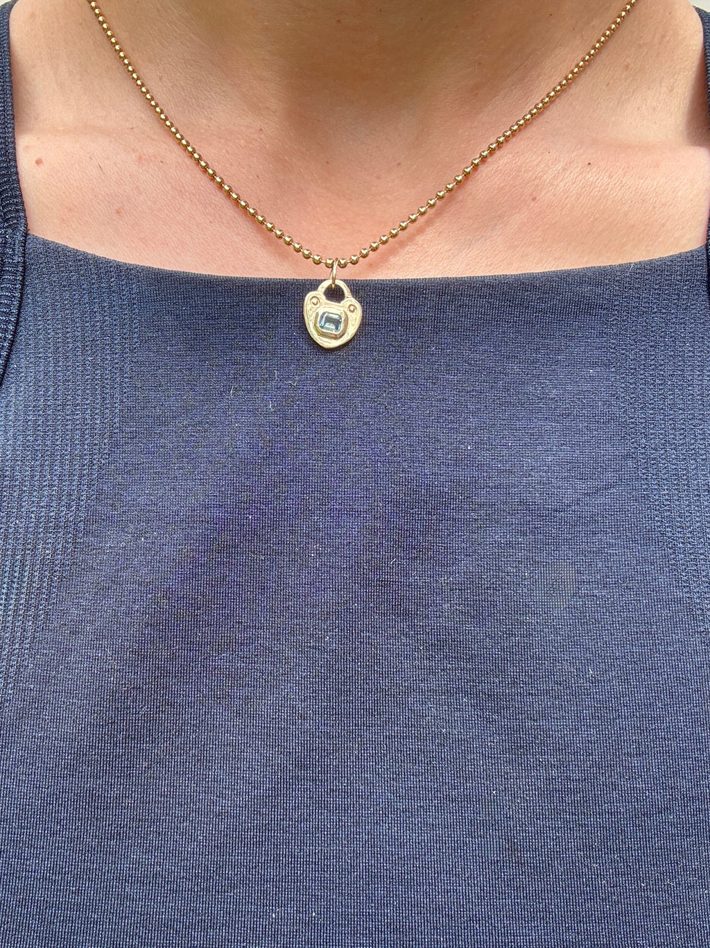 The heart keep charm in 14k gold by Mellis Fine