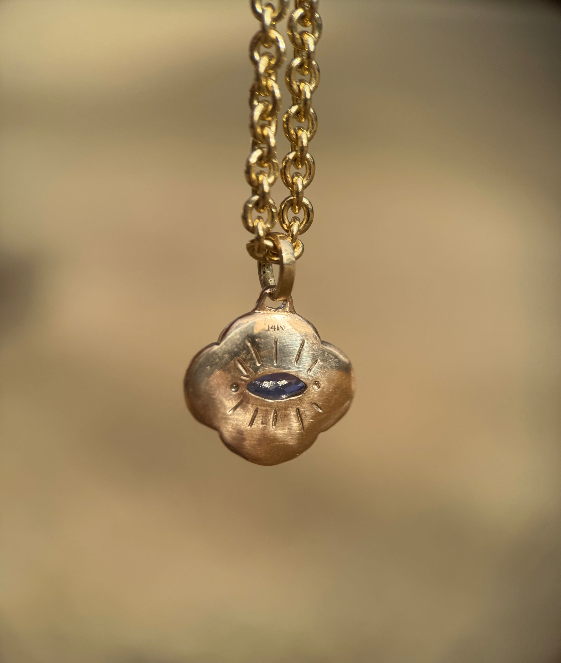 Watchful sapphire cloud pendant