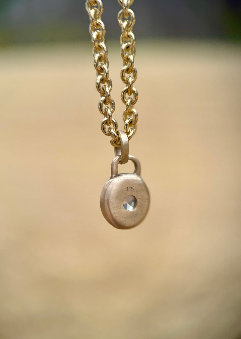 Icy blue sapphire lock pendant