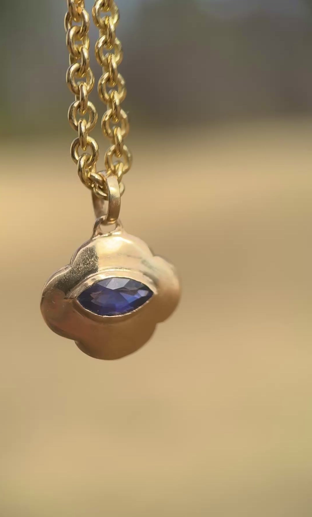 Watchful sapphire cloud pendant