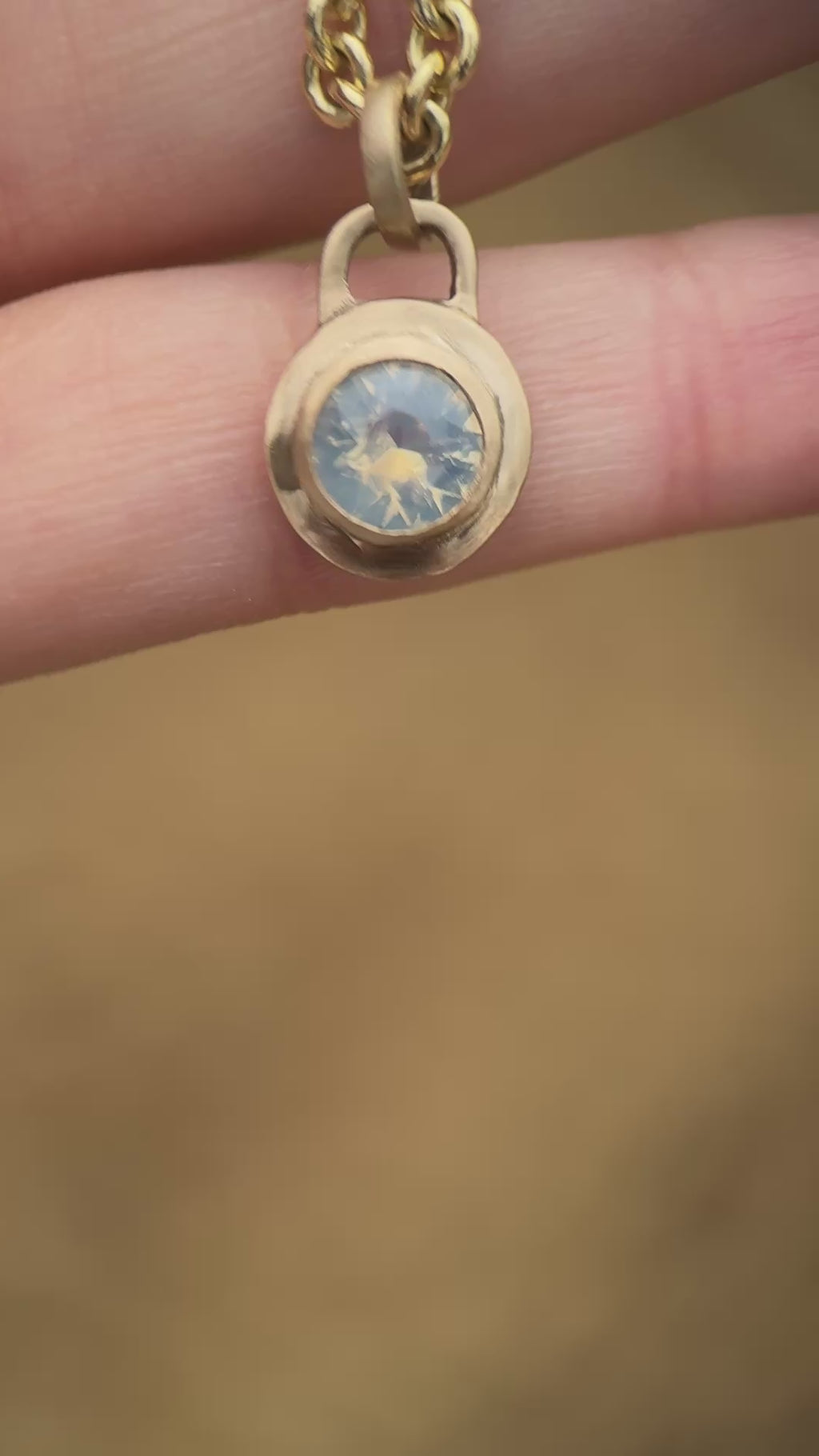 Icy blue sapphire lock pendant