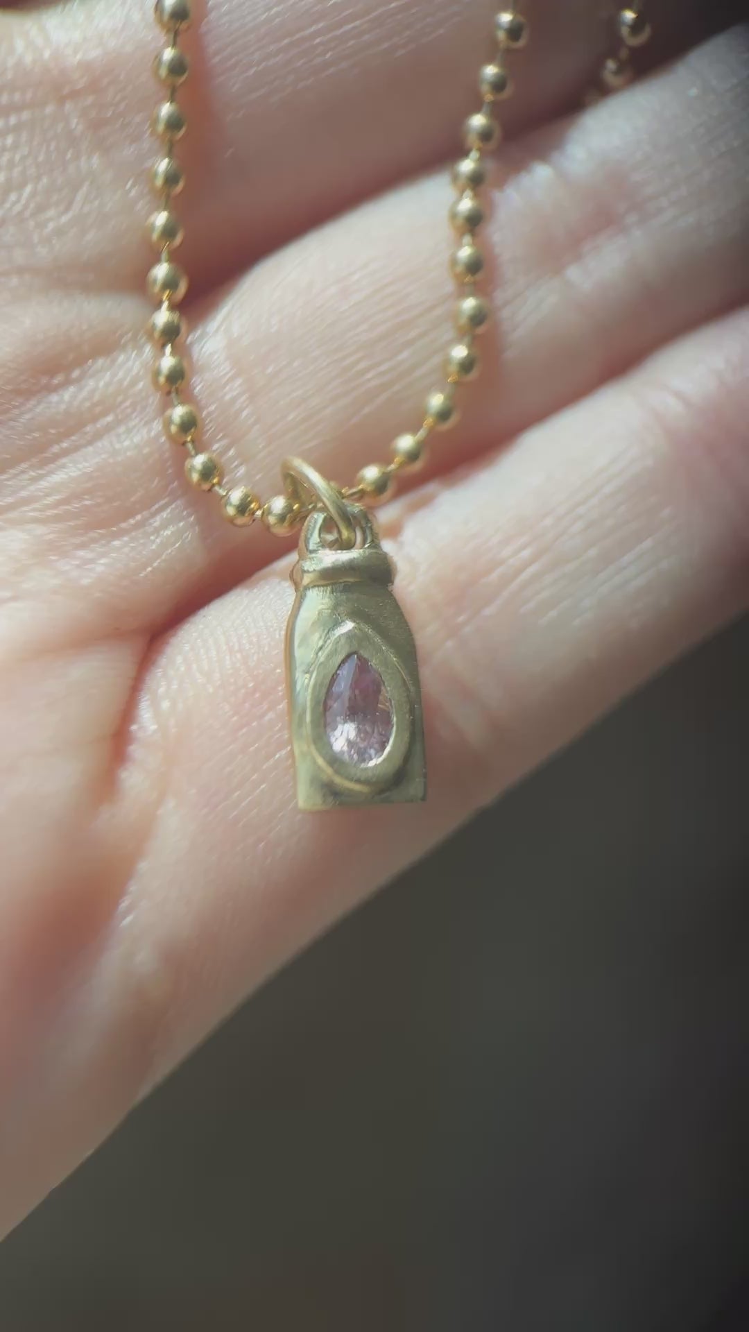 Nectar bottle charm: padparadscha sapphire